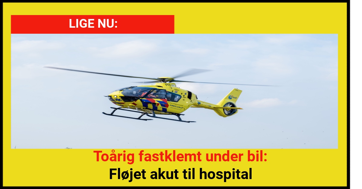 Toårig fastklemt under bil: Fløjet akut til hospital