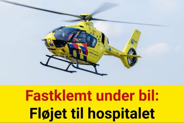 Fastklemt under bil: Fløjet til hospitalet