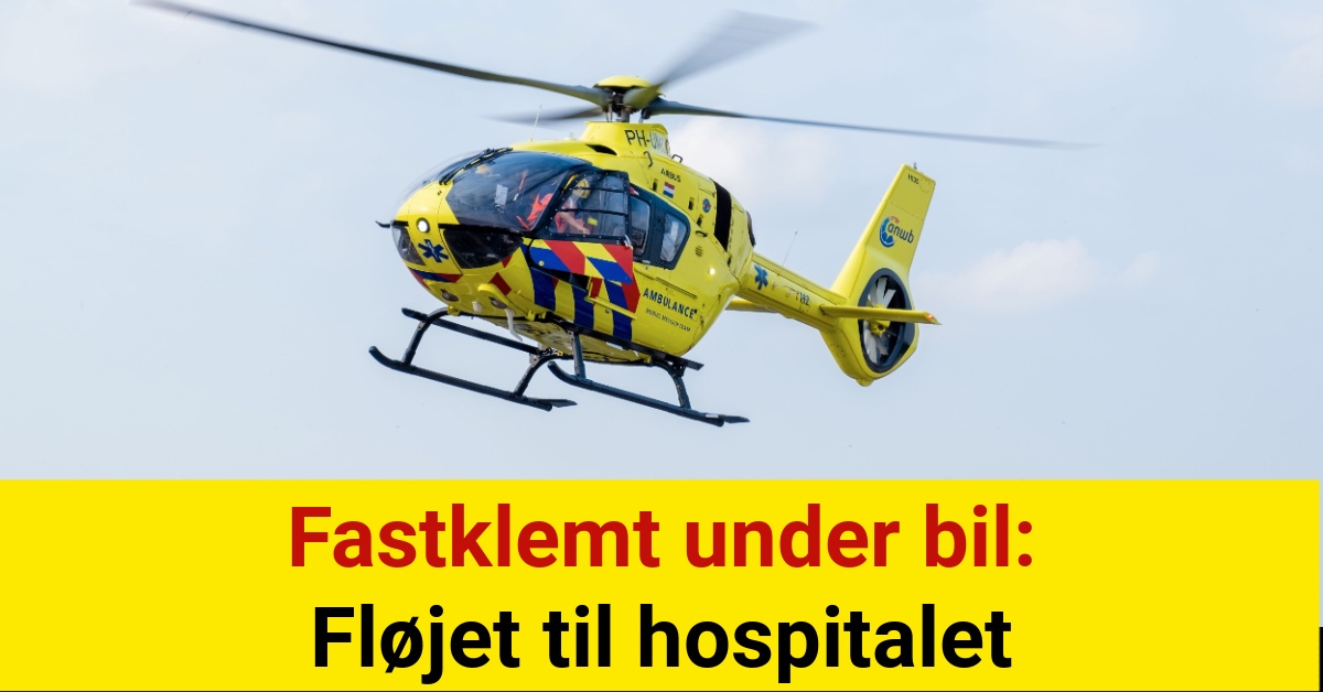 Fastklemt under bil: Fløjet til hospitalet