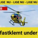 Mand fastklemt under lastbil